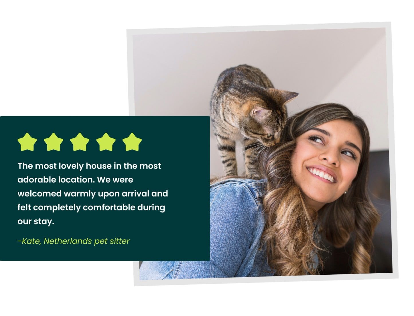 A woman smiling with a cat on her shoulders